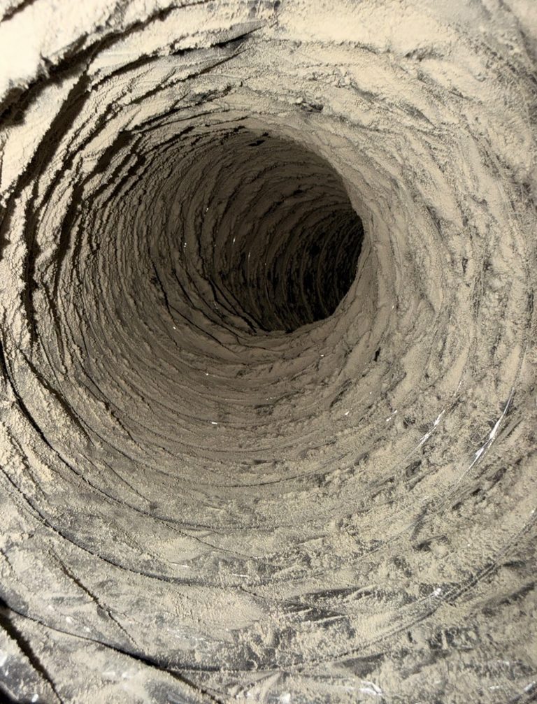 Inside a flexible air duct coated with dust